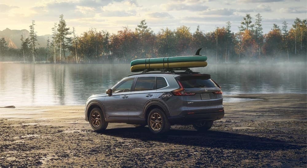 A grey 2023 Honda CR-V is shown from the rear at an angle.