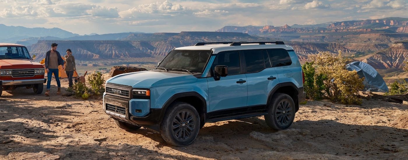 A blue 2024 Toyota Landcruiser is shown from the front at an angle after leaving a Toyota dealer near Scottsville.