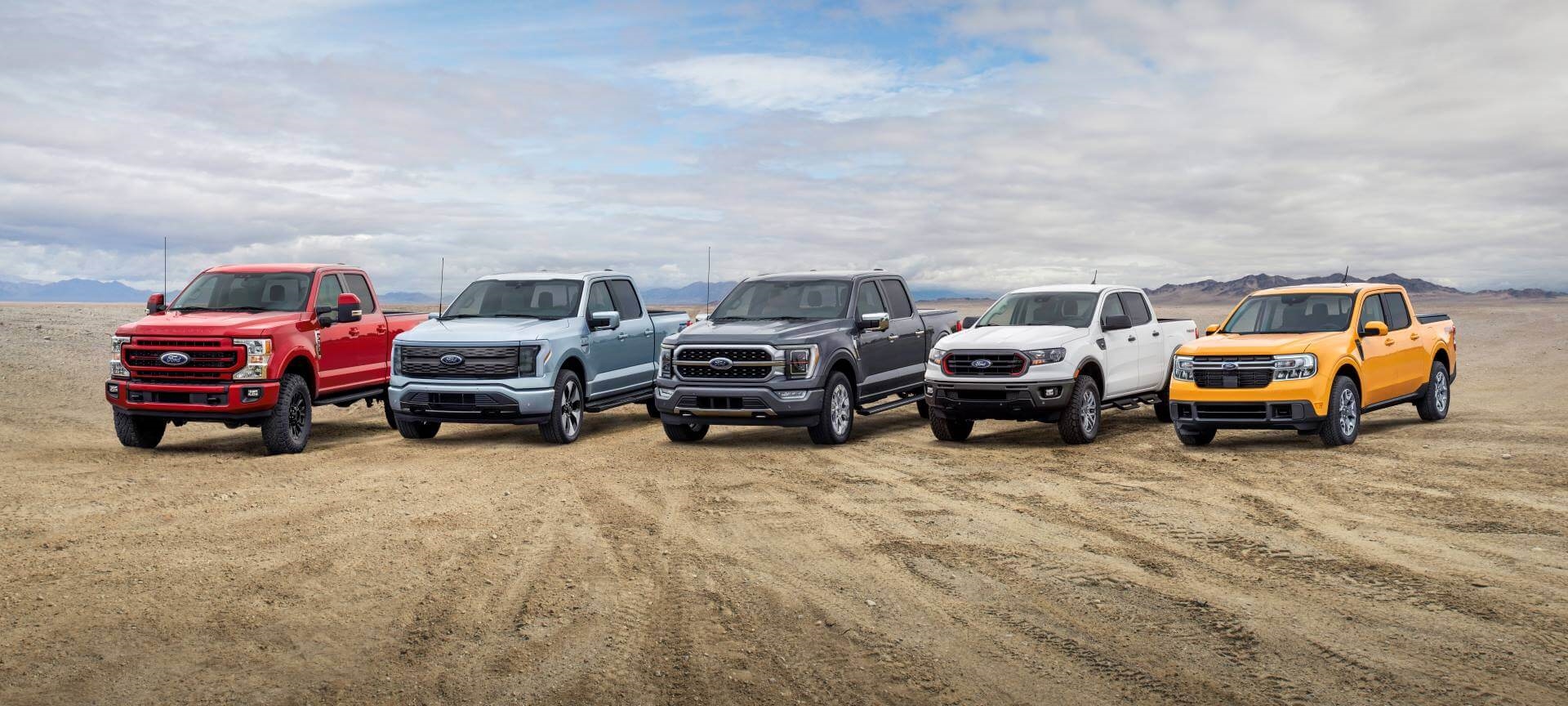 Ford F-250, Ford F-150 Lightning, Ford F-150, Ford Ranger and Ford Maverick lined up in So Cal desert.