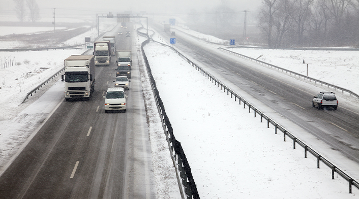 Cars driving on winter road