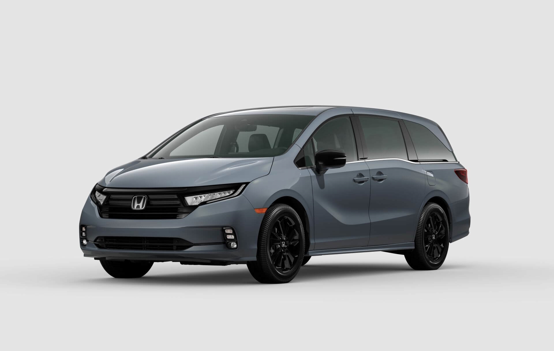 New Sport Honda Odyssey in cobalt color against white background.