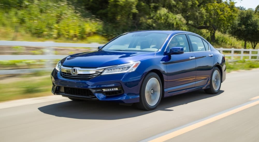 A blue 2017 Honda Accord for sale is shown from the front at an angle.