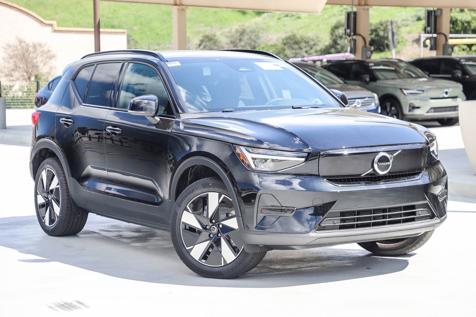 black 2024 Volvo XC40 recharge electric SUV parked at the Volvo Cars Mission Viejo dealership