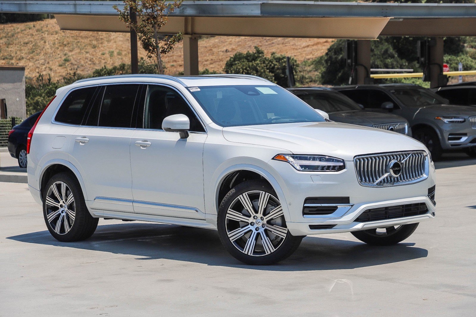 white 2024 Volvo XC90 Hybrid SUV parked at the Volvo Cars Mission Viejo dealership in Mission Viejo, CA