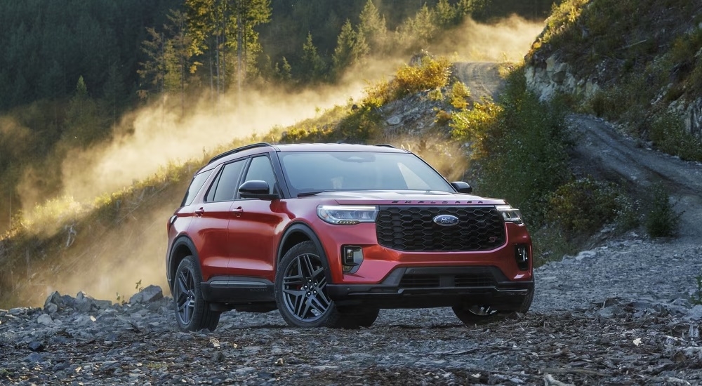 A red 2025 Ford Explorer ST for sale in Rhinebeck parked in a clearing.