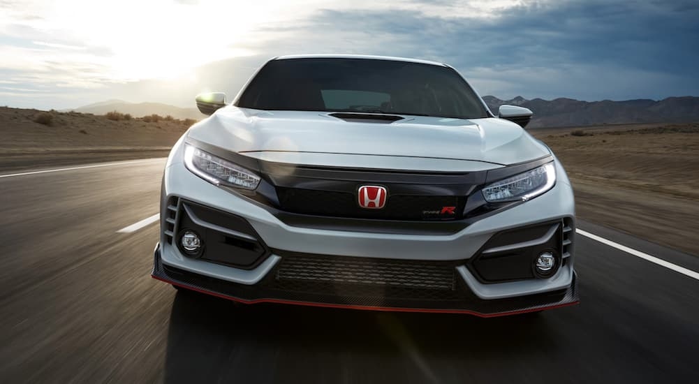 A white 2020 Honda Civic Type R is shown from the front after leaving a used Honda dealership.