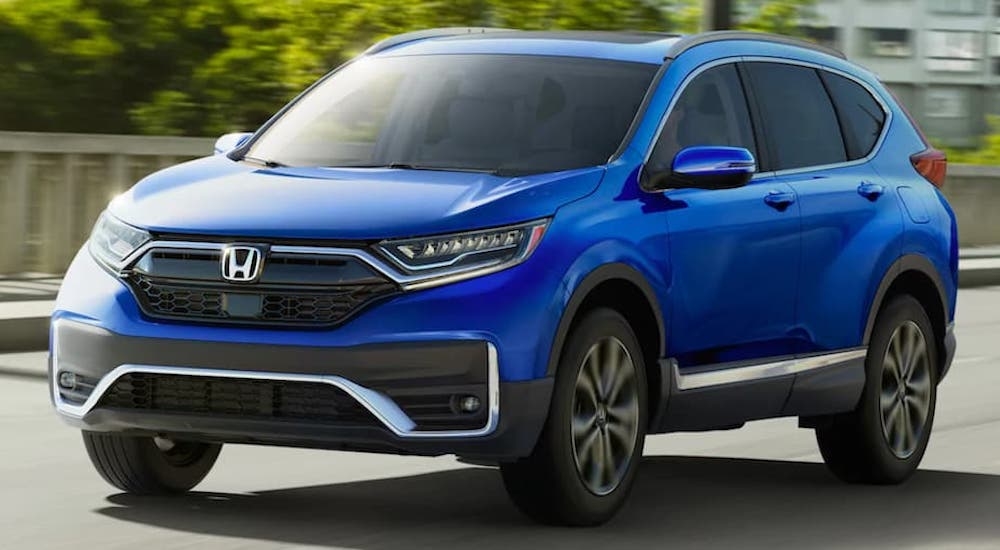 A blue 2020 Honda CR-V is shown from the front at an angle after leaving a used Honda dealer.