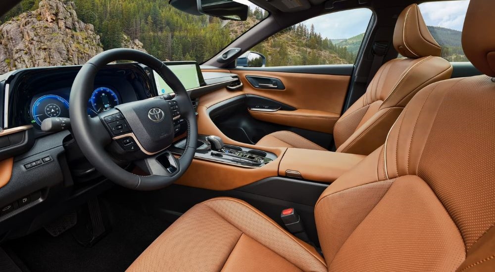 The brown interior of a 2025 Toyota Crown Signia is shown from the driver's side.