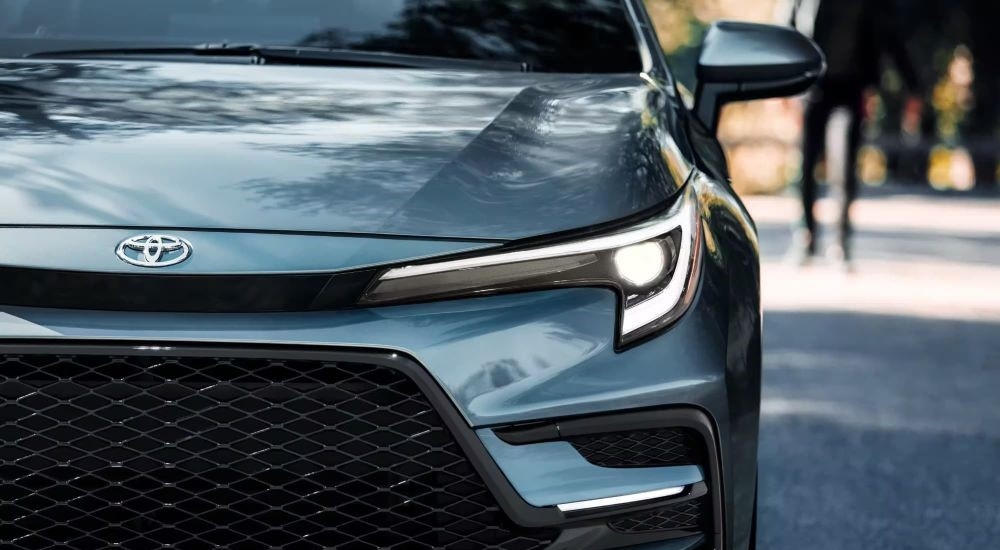 Close-up of the grille and headlight on a 2024 Toyota Corolla XSE for sale.