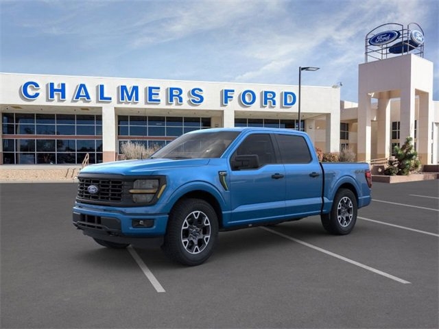 blue 2024 Ford F-150 truck parked at the Chalmers Ford dealership in Albuquerque, NM