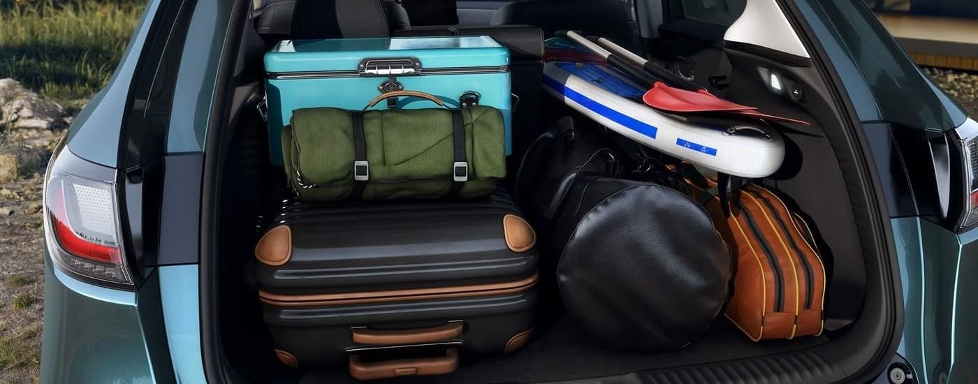 Gear is shown in the trunk of a blue 2025 Honda HR-V EX-L.