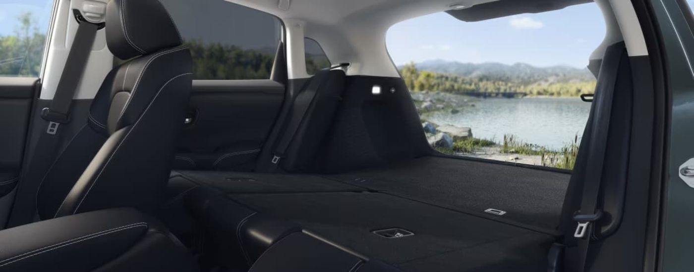 The black interior and rear folded seats are shown in a 2023 Honda HR-V.