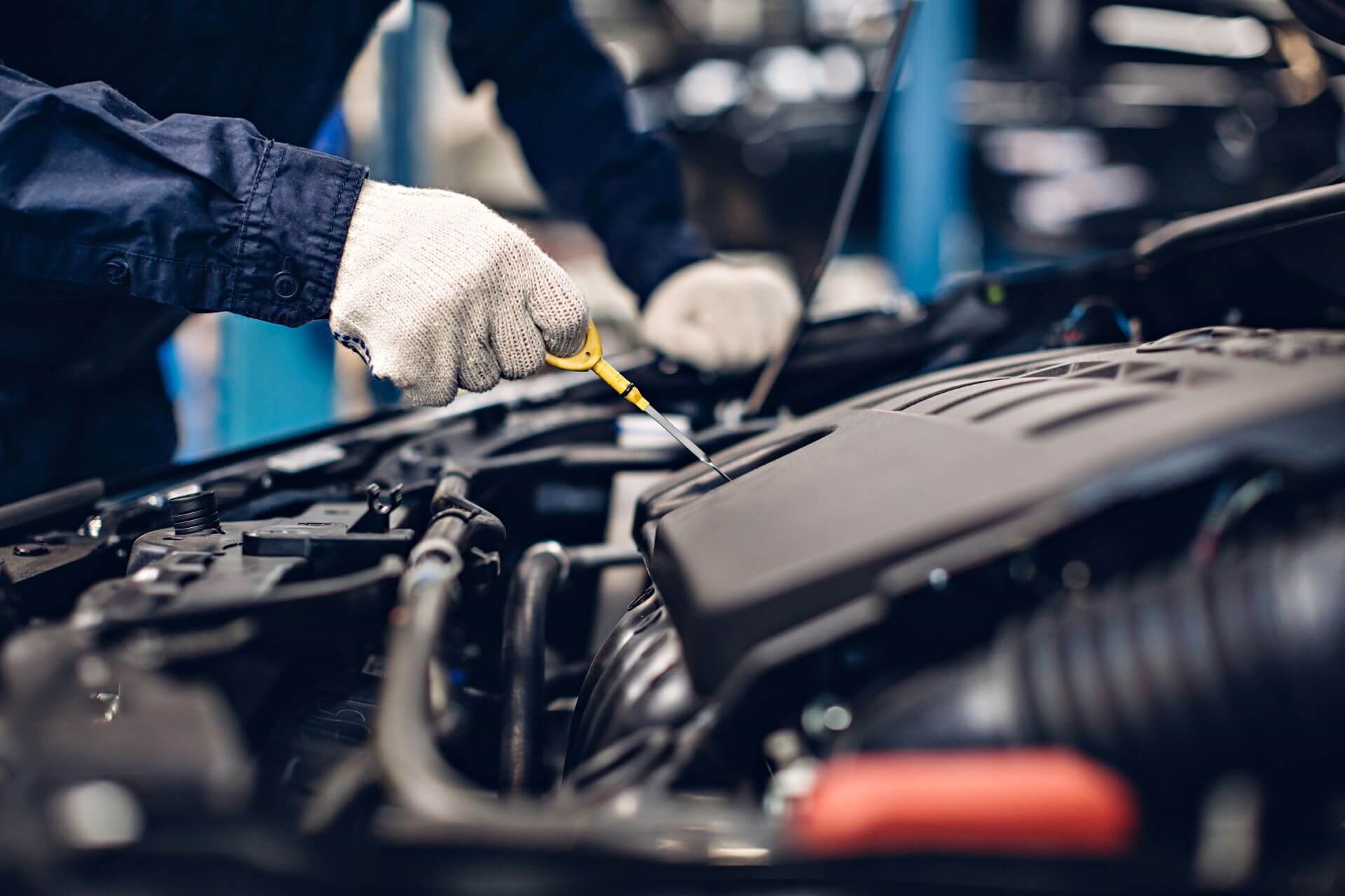 Service technician performing oil change.