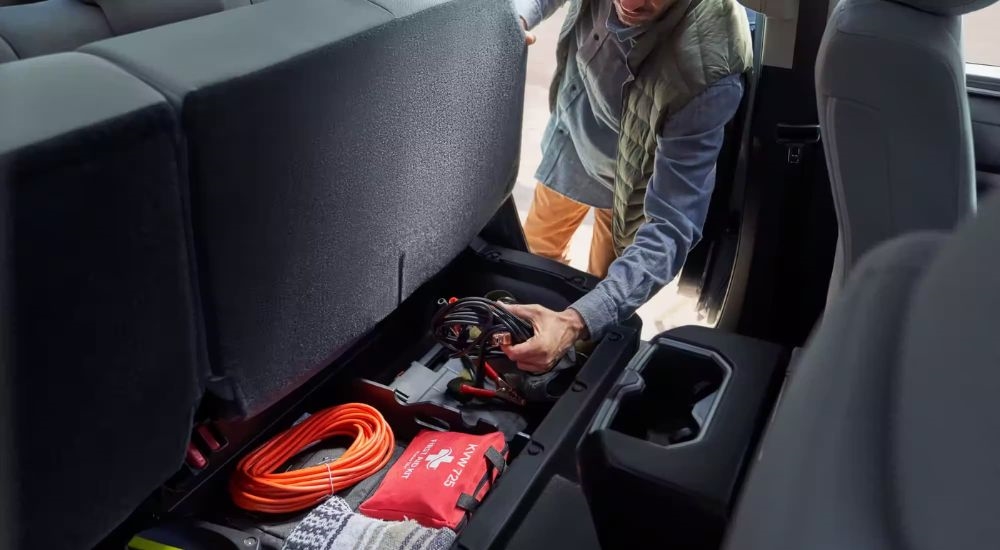 Under seat storage is shown in a 2024 Toyota Tundra SR5.