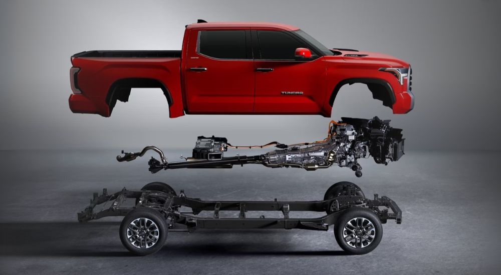 A cutwawy view is shown of a red 2024 Toyota Tundra.