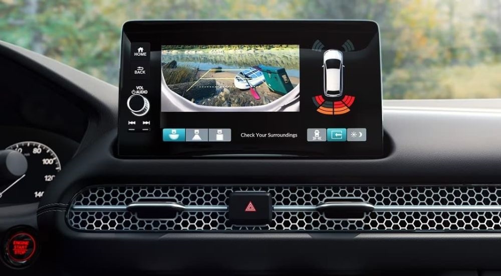 A close-up shows the infotainment screen in a 2025 Honda HR-V EX-L.