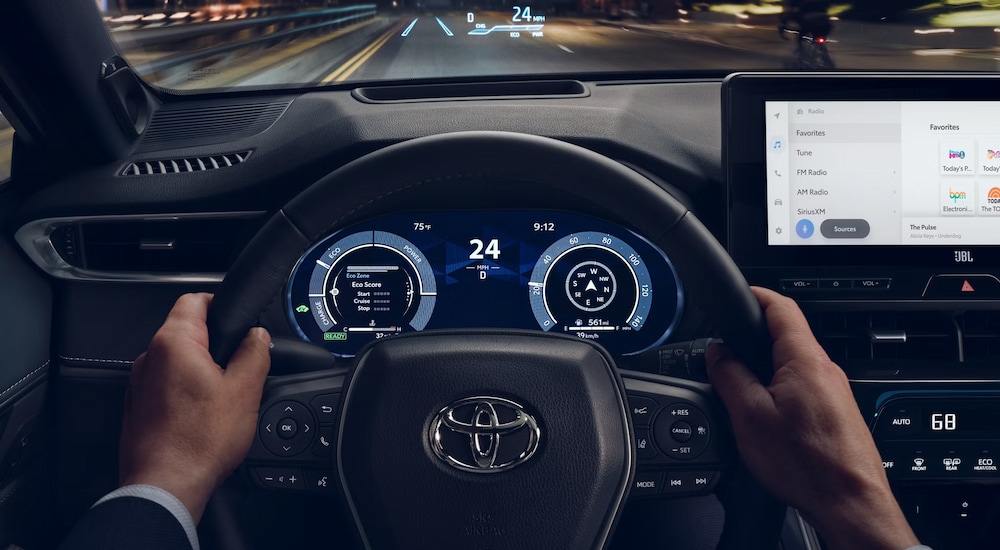 The digital instrument cluster and head up display in a 2024 Toyota Venza for sale.