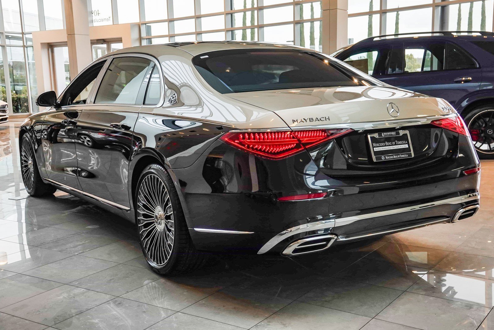 black and gold dual tone mercedes s580 maybach sedan at the Mercedes-Benz of Temecula dealership