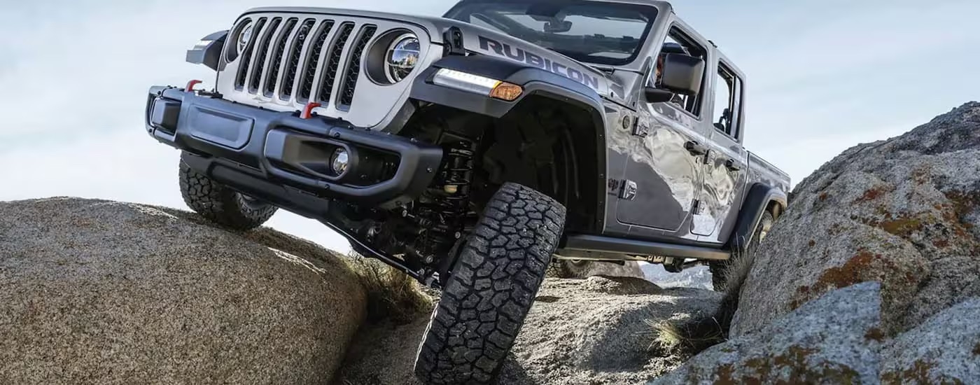 A 2023 Jeep Gladiator Rubicon is shown off-roading after leaving a Jeep dealer near Kingston.