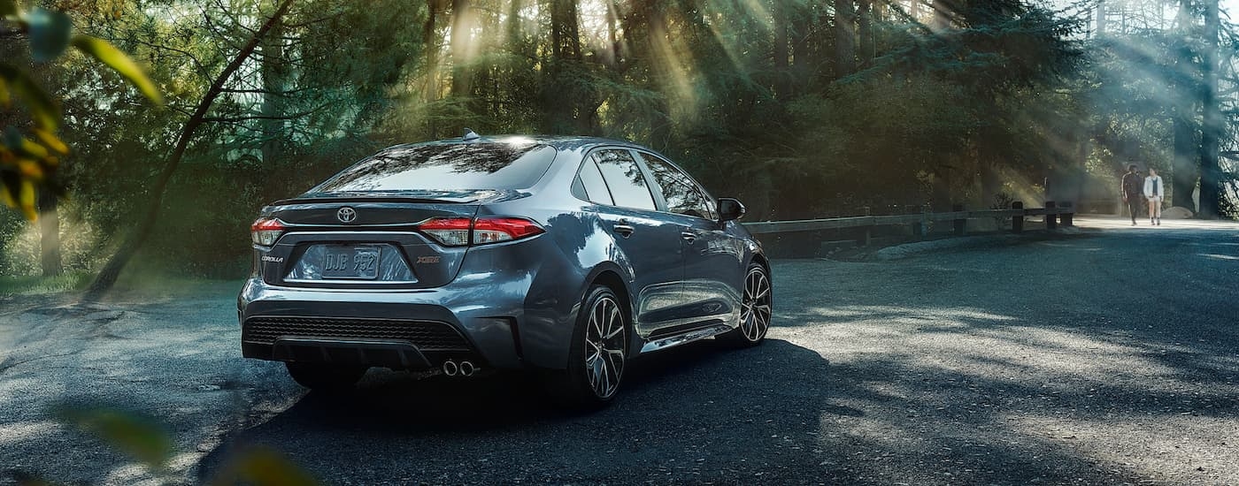 A rear view of a parked grey 2020 Toyota Corolla XSE.