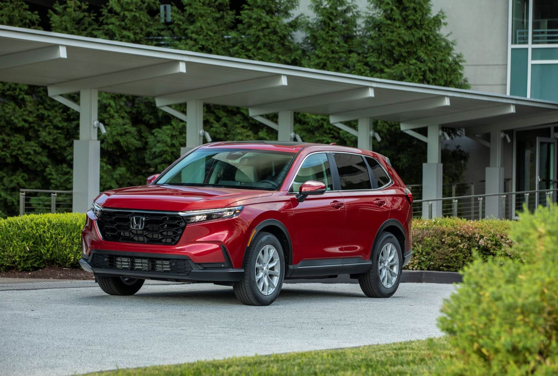 Newer used Honda CR-V EX-L in red on driveway in SoCal