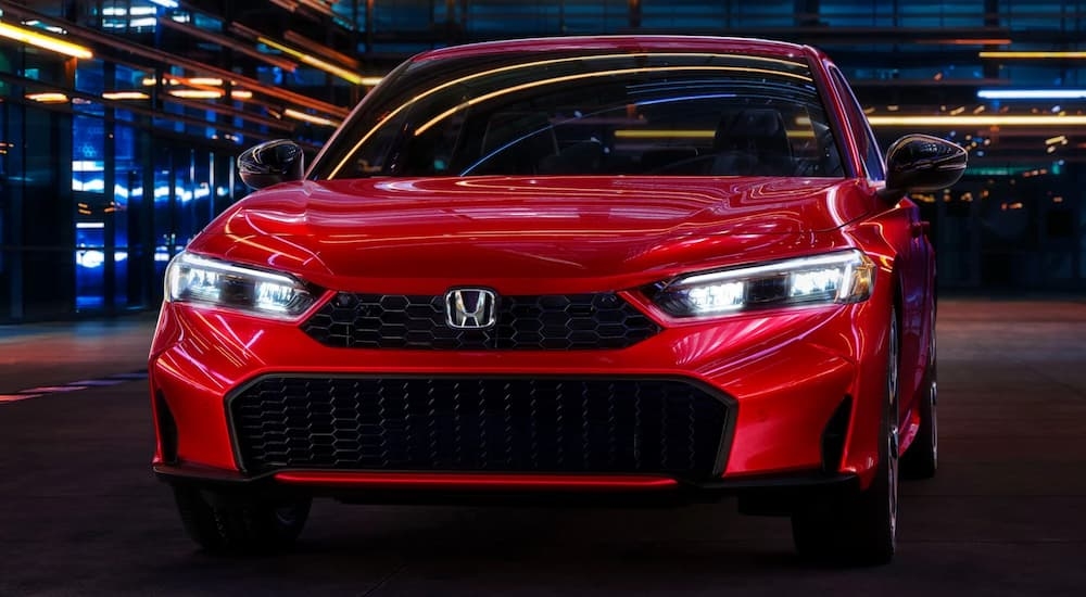 Close-up on the hood of a red 2025 Honda Civic.