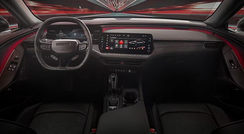 A close up shows the black dash and infotainment screen in a 2025 Dodge Charger.