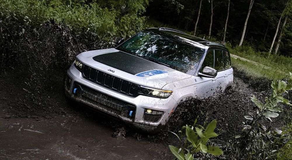 A silver 2022 Grand Cherokee 4xe Trailhawk is shown off-roading after leaving a Jeep dealer near Poughkeepsie.