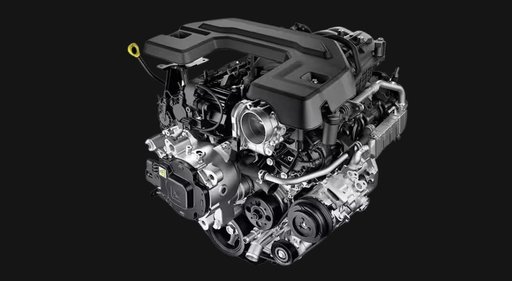 A close-up shows a 2025 Ram 1500 Pentastar engine against a black background.