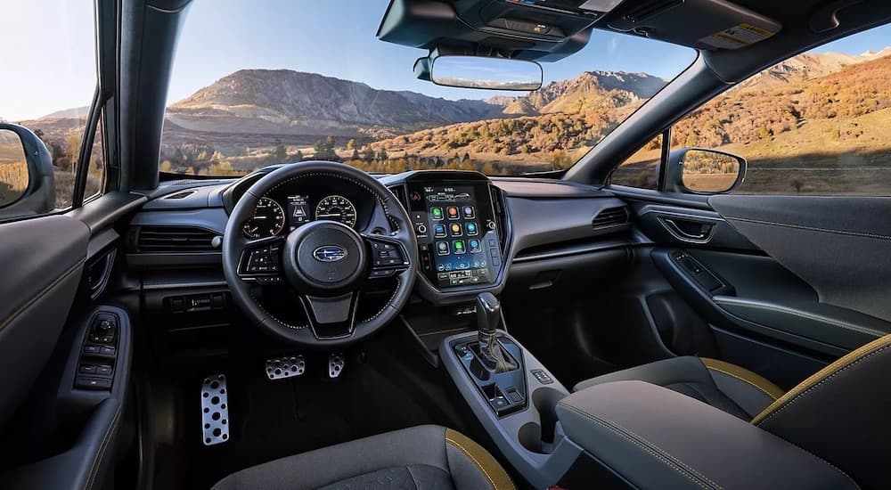 The interior of a 2024 Subaru Crosstrek for sale in Rhinebeck is shown from the driver's seat.