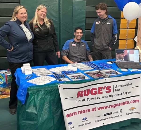Four people at a Ruge's table.