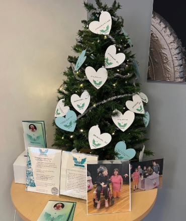 A Christmas tree for charity is shown.