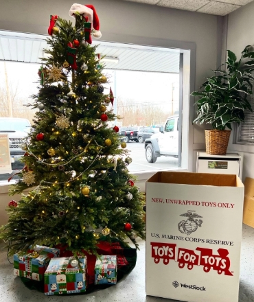 A Christmas tree for charity is shown.
