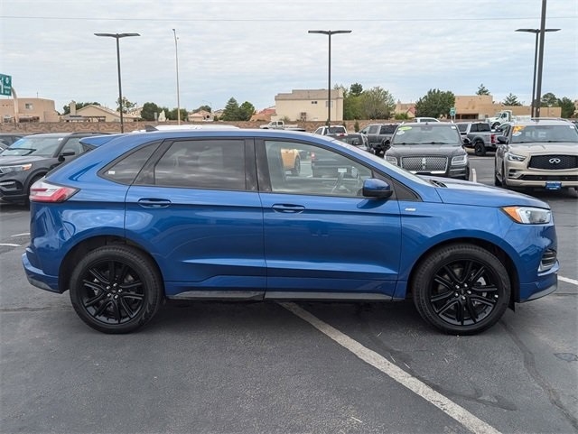 blue 2024 Ford Edge crossover parked at the Chalmers Ford dealership in Albuquerque, NM