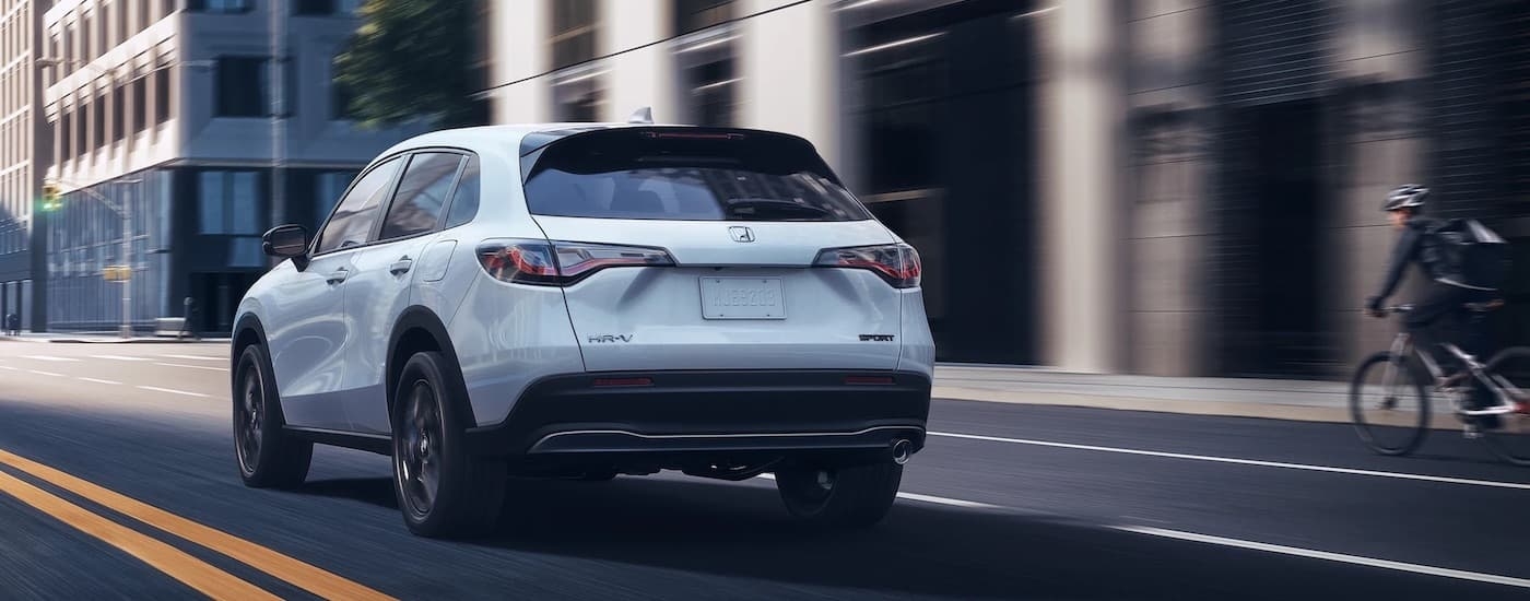 A white 2023 Honda HR-V is shown from the rear at an angle.