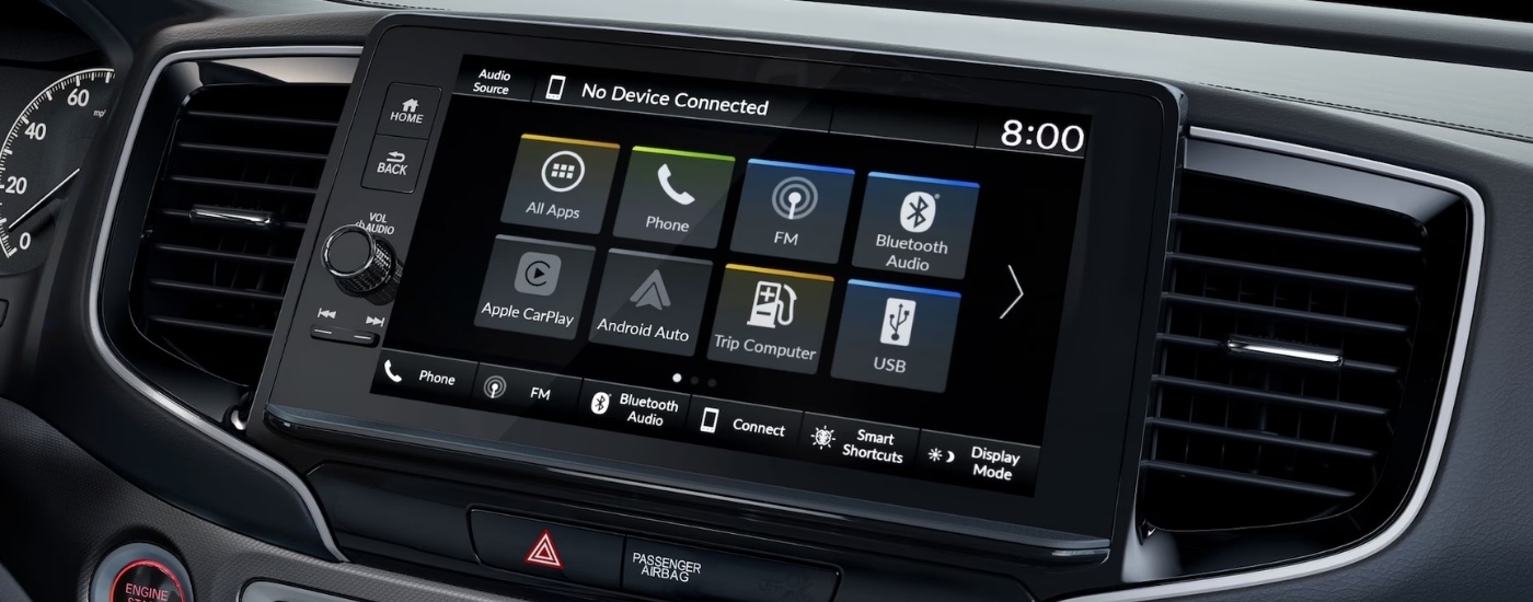 A close-up shows the apps on the infotainment screen in a 2025 Honda Ridgeline.