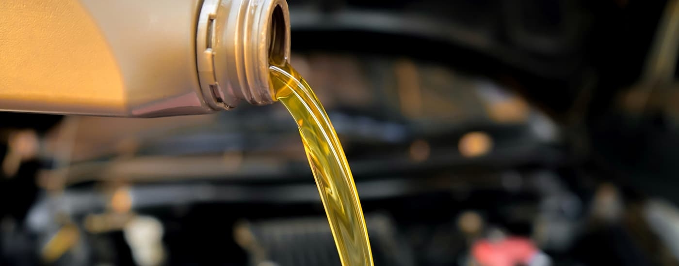 Close-up of an oil can being poured.