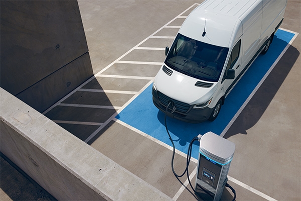 white 2025 Mercedes eSprinter van charging at an EV charger in Temecula, CA