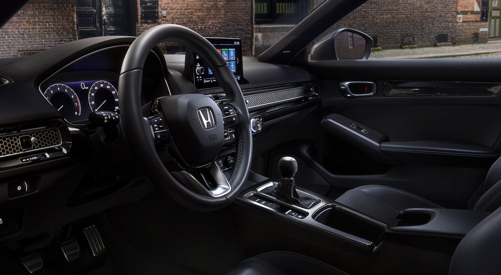 Side view of the cockpit in a 2025 Honda Civic Hatchback Sport Touring.