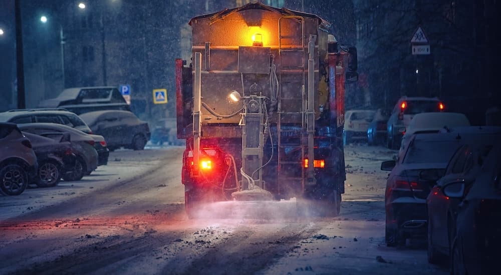 A salt truck is shown during winter.