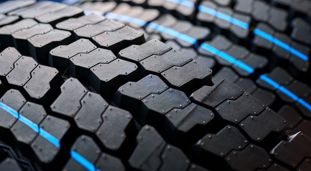 A close-up shows tread on a winter tire.