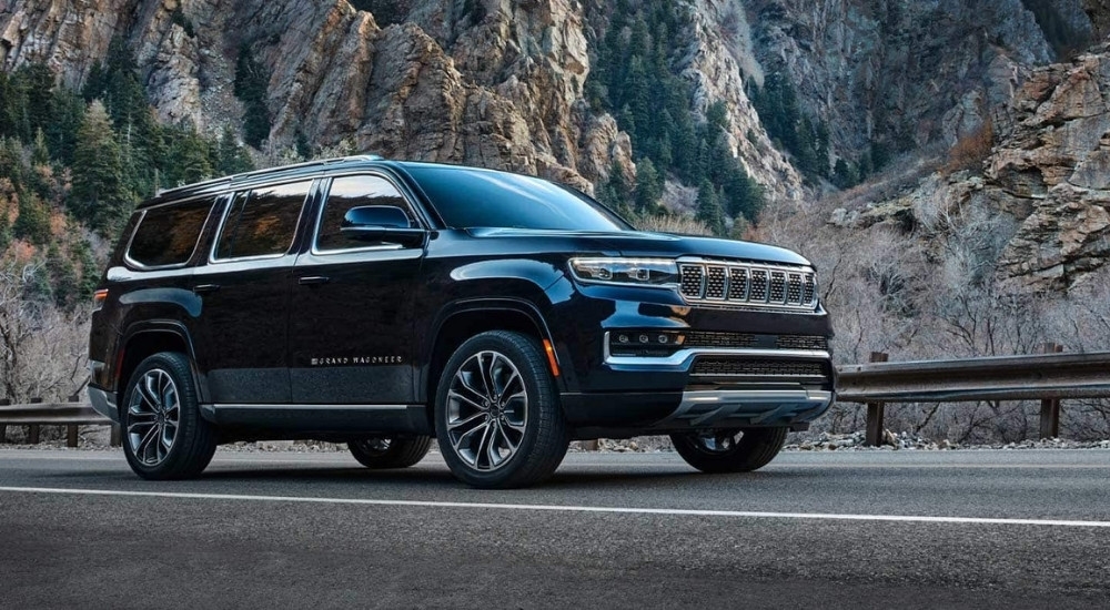 A black 2022 Jeep Grand Wagoneer is shown from the side.