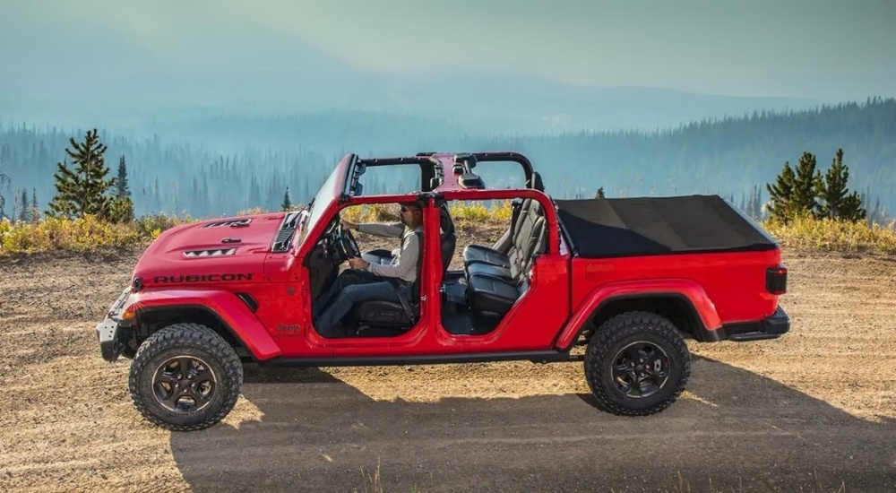 A red 2020 Jeep Gladiator Rubicon is shown from the side.