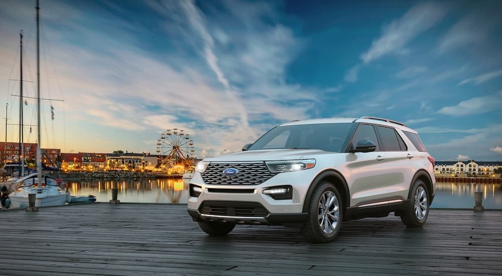 A white 2024 Ford Explorer is shown from the front at an angle.