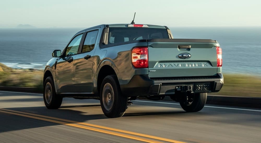 A grey 2024 Ford Maverick XLT Hybrid is shown from the rear at an angle after leaving a Ford dealer near Keene.