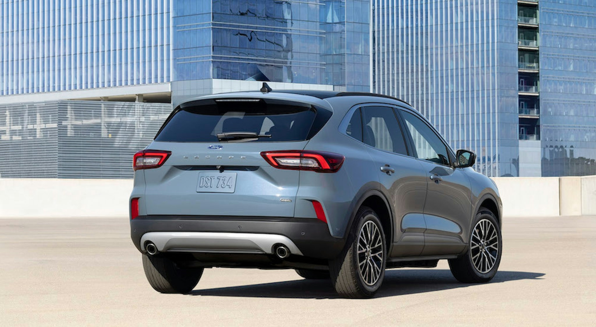 A blue 2025 Ford Escape is shown from the rear at an angle.