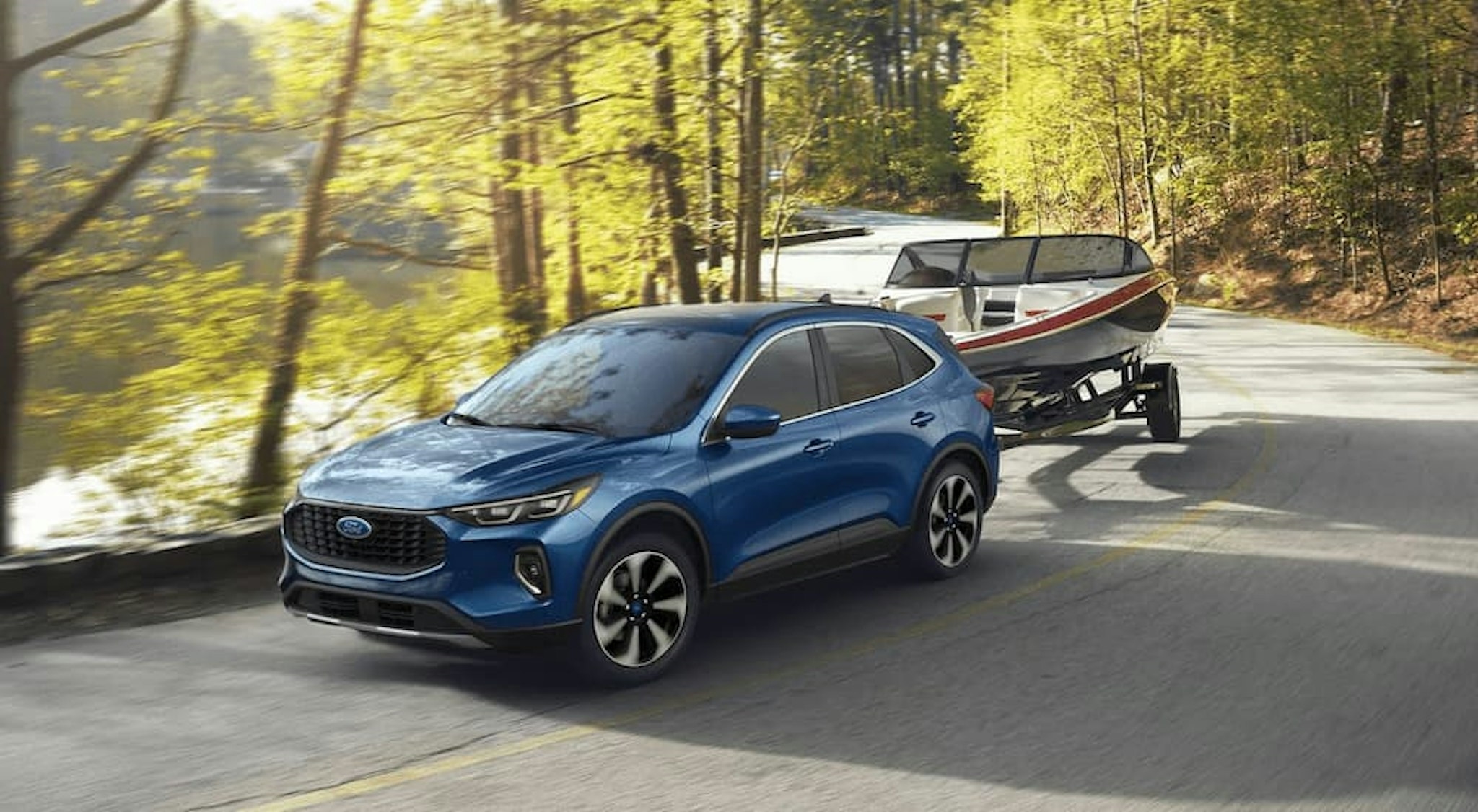 A blue 2023 Ford Escape is shown towing a boat after leaving a Ford SUV dealer.