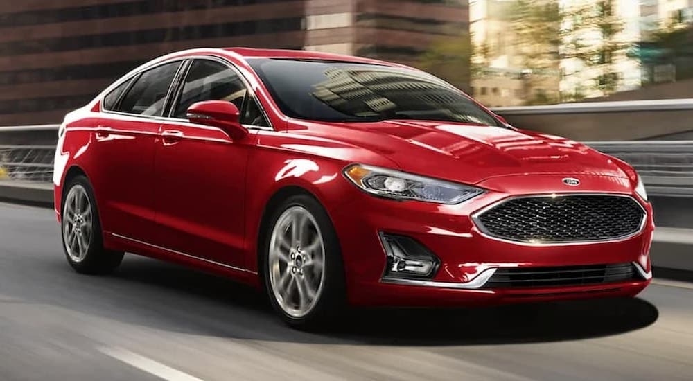 A red 2020 Ford Fusion is shown from the front at an angle after leaving a dealer that has used cars for sale in Westminster.