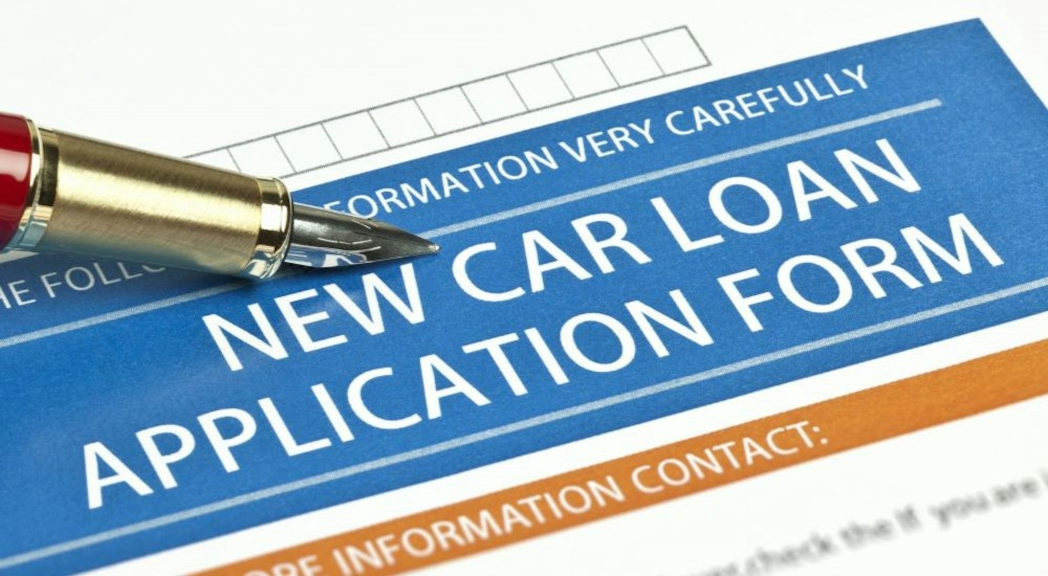 A pen is shown on a subprime auto loan near Claremont NH.