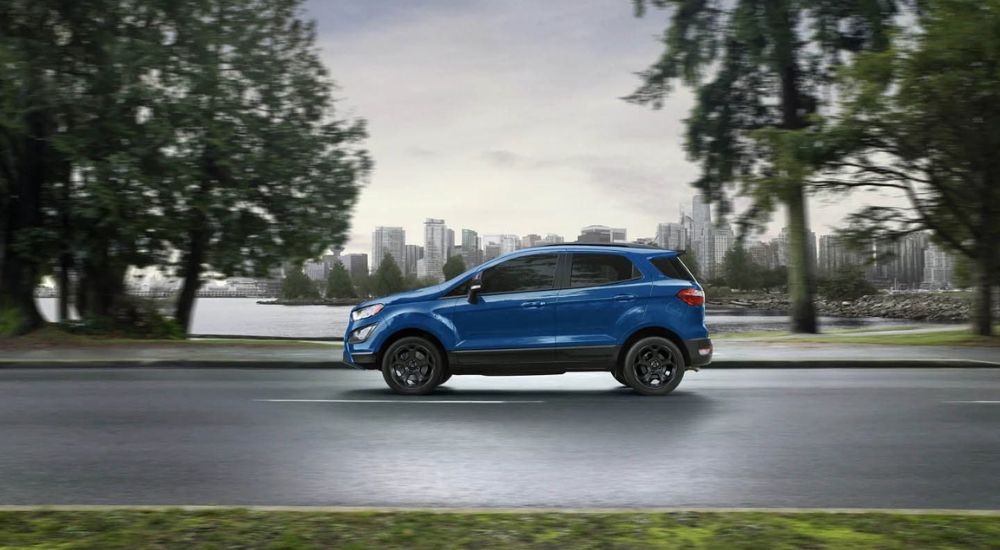 A blue 2021 Ford EcoSport is shown after looking at used cars for sale near Keene.